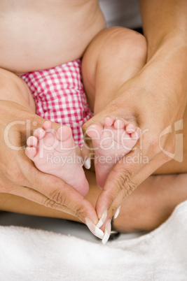 mother holding her child's feet