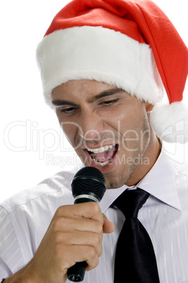 young man singing into microphone