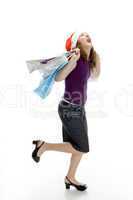 cheerful lady holding carry bags
