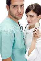 nurse standing with patient showing stethoscope