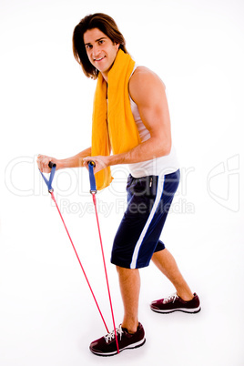 side view of man stretching rope