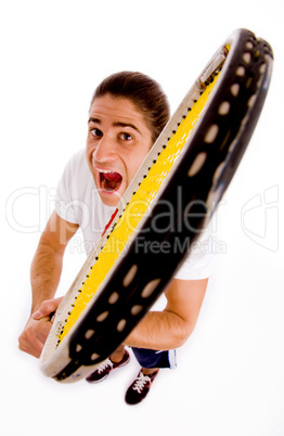 high angle view of shouting male with racket