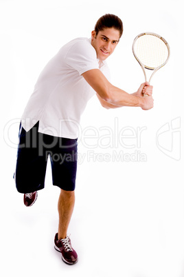 front view of man playing tennis