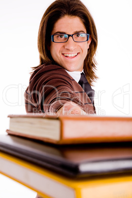 portrait of smiling student showing books