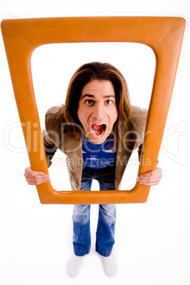 top view of male holding wooden frame