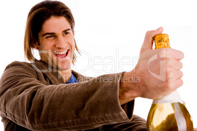 portrait of man holding champagne bottle