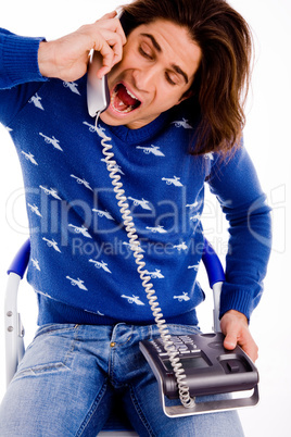 front view of man shouting on phone