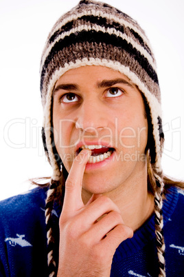 portrait of thinking man wearing woollen cap