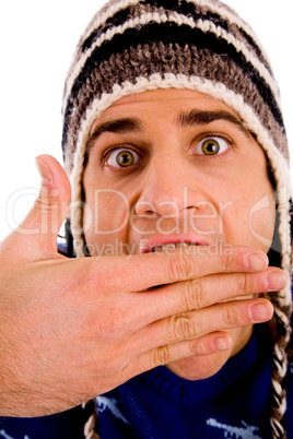 portrait of shocked man wearing woollen cap