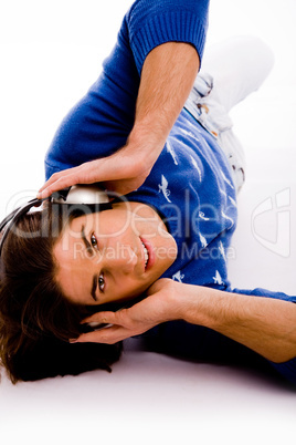 top view of man holding headphone