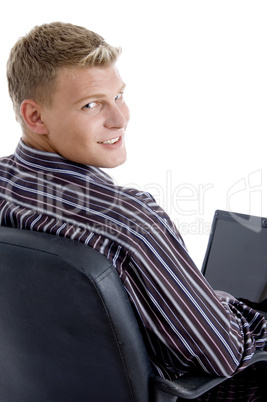 smart guy with laptop looking at camera