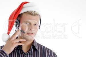 american man wearing headphone and santa hat