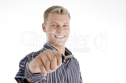 smiling handsome man holding key