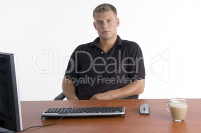 man with laptop and tea