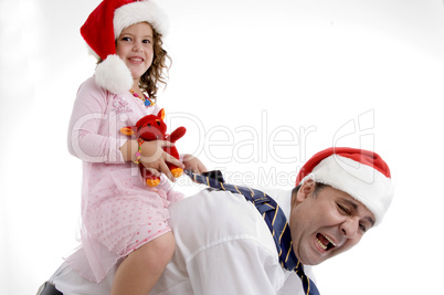 little girl sitting on her father's back