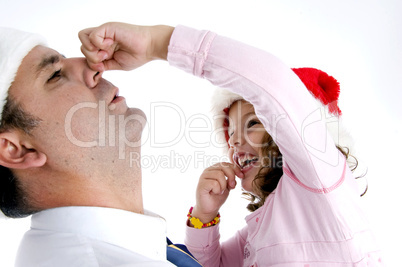 girl holding her father's nose