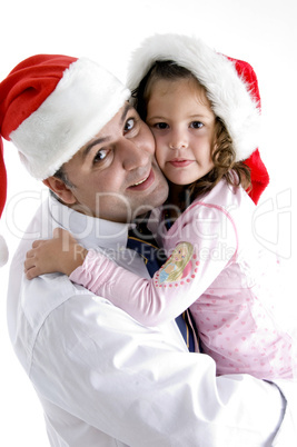 father and cute daughter with christmas hat