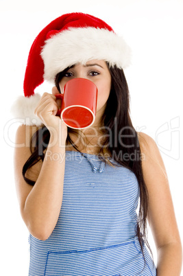 girl with christmas hat and taking coffee