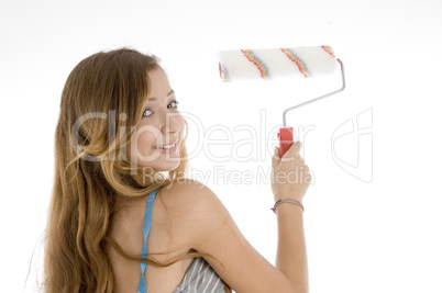 female painter with roller brush