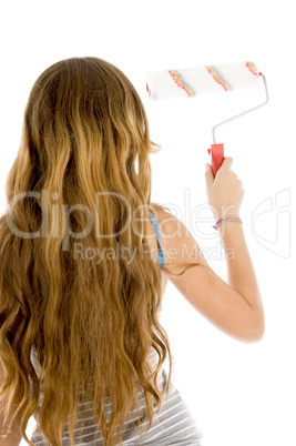 back pose of girl with roller brush