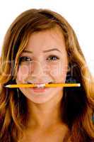pretty girl holding pencil in mouth