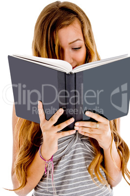 student reading her notebook