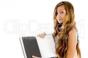 pretty teenager showing notebook