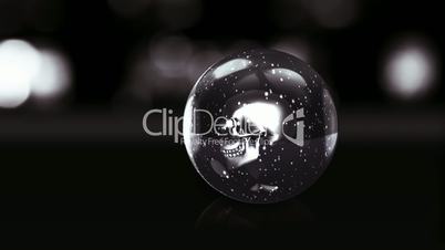 skull in dark glass ball with snow
