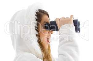astonished female watching through binocular