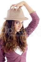 young girl holding hat