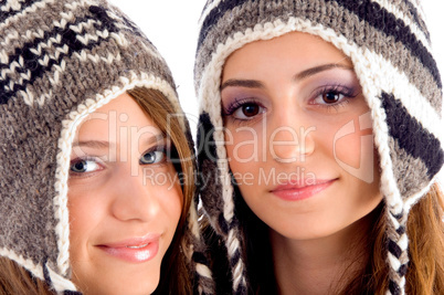 close up view of cute teens wearing woolen cap