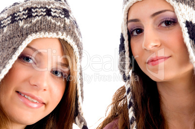 two young friends wearing woolen cap and looking at camera