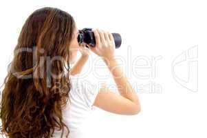 teenager girl watching through binocular