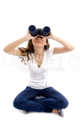 sitting female looking through binocular