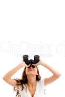 girl looking upward through binocular