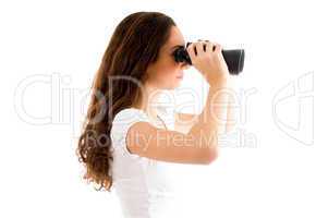 side pose of female holding binocular