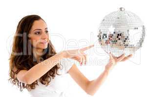young girl indicating disco ball