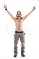 shirtless male raising his hands