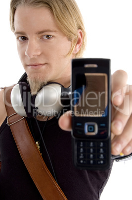 smart guy with bag and headphone showing his cell phone
