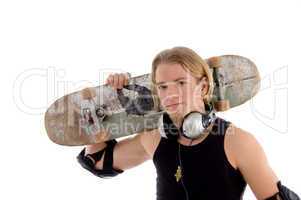 handsome man holding skateboard