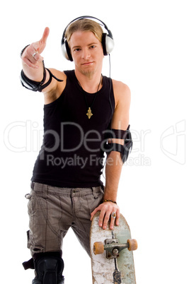 stylish male skater showing hand gesture