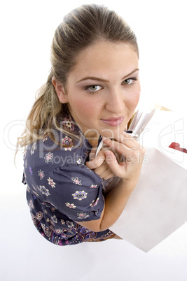 woman with shopping bags and looking at camera