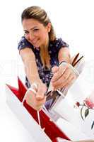 smiling woman showing shopping bags