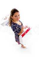 smiling woman holding shopping bags