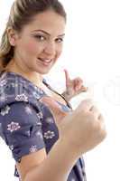 young girl showing thumb up with both hands