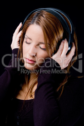 portrait of young woman enjoying music