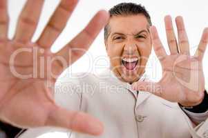 portrait of happy businessman showing palms