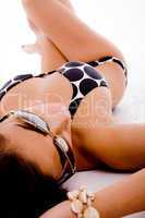 top view of laying sensuous woman with sunglasses