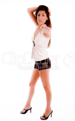 side view of sexy woman pointing at camera