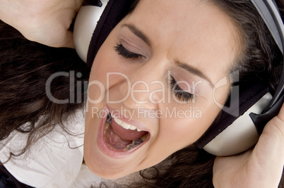 female shouting while listening music
